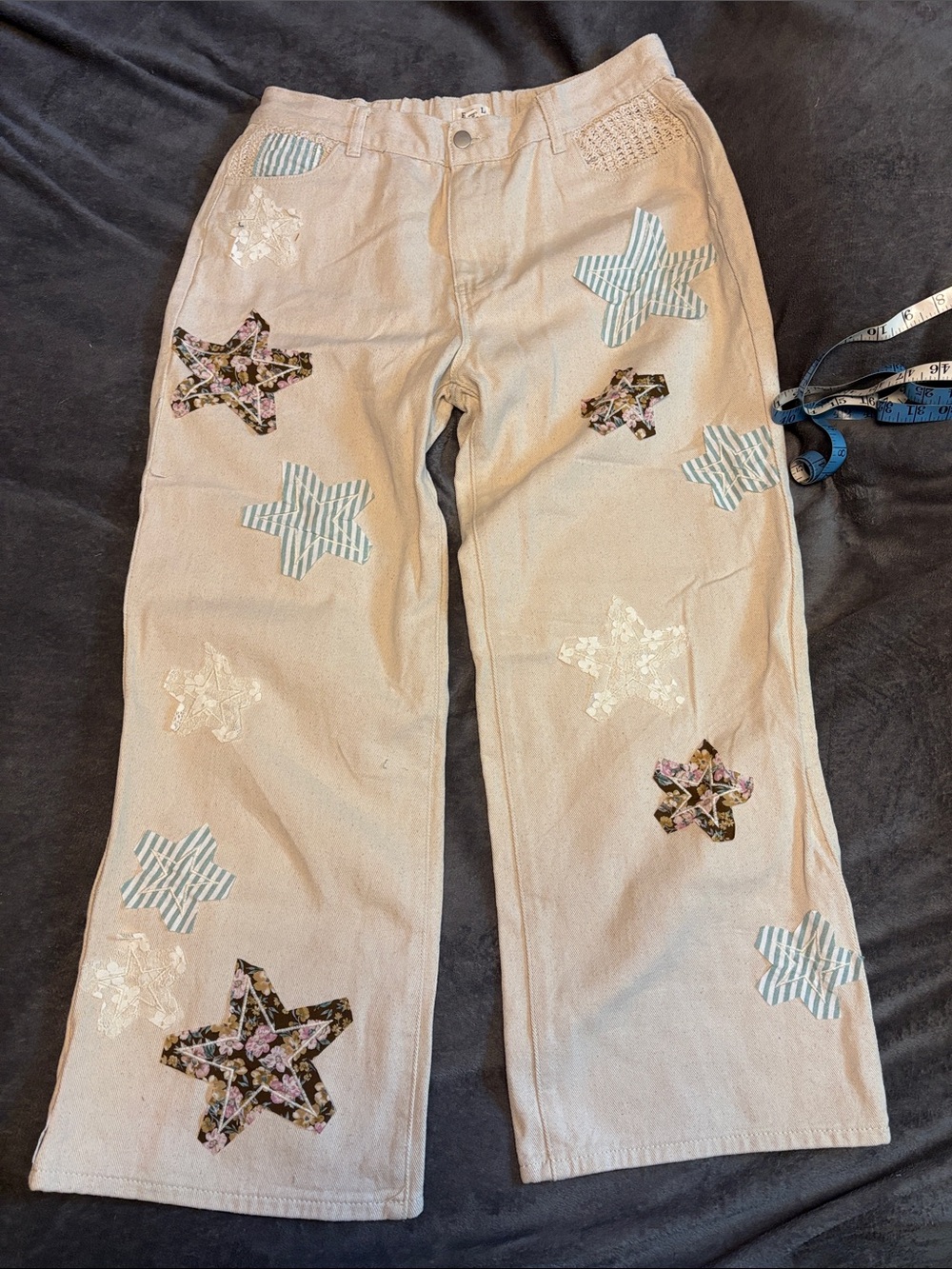POL Beige Wide-Leg Pants with Blue Stripe and Floral Star Patches